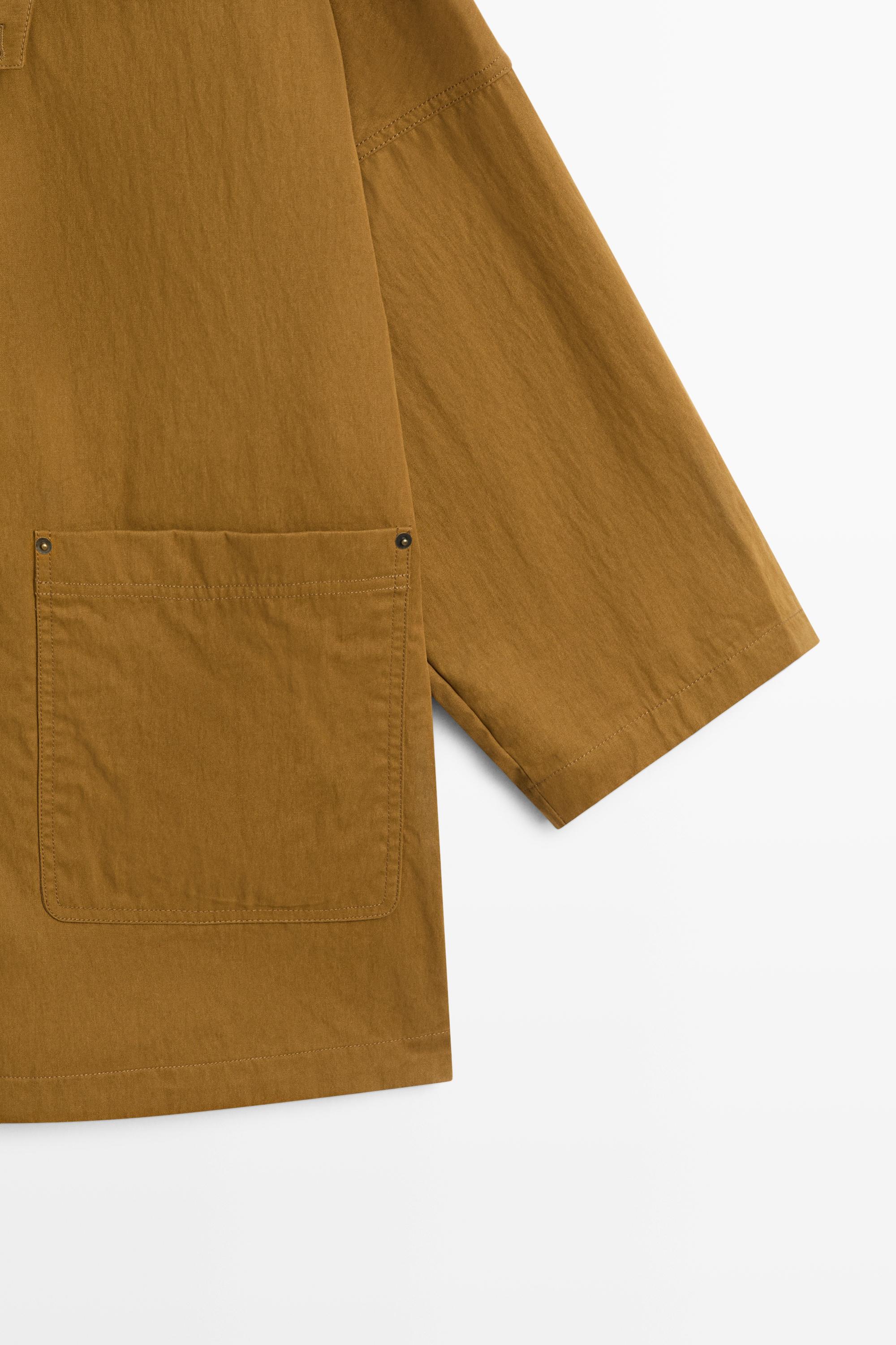 Button-tab cape jacket
